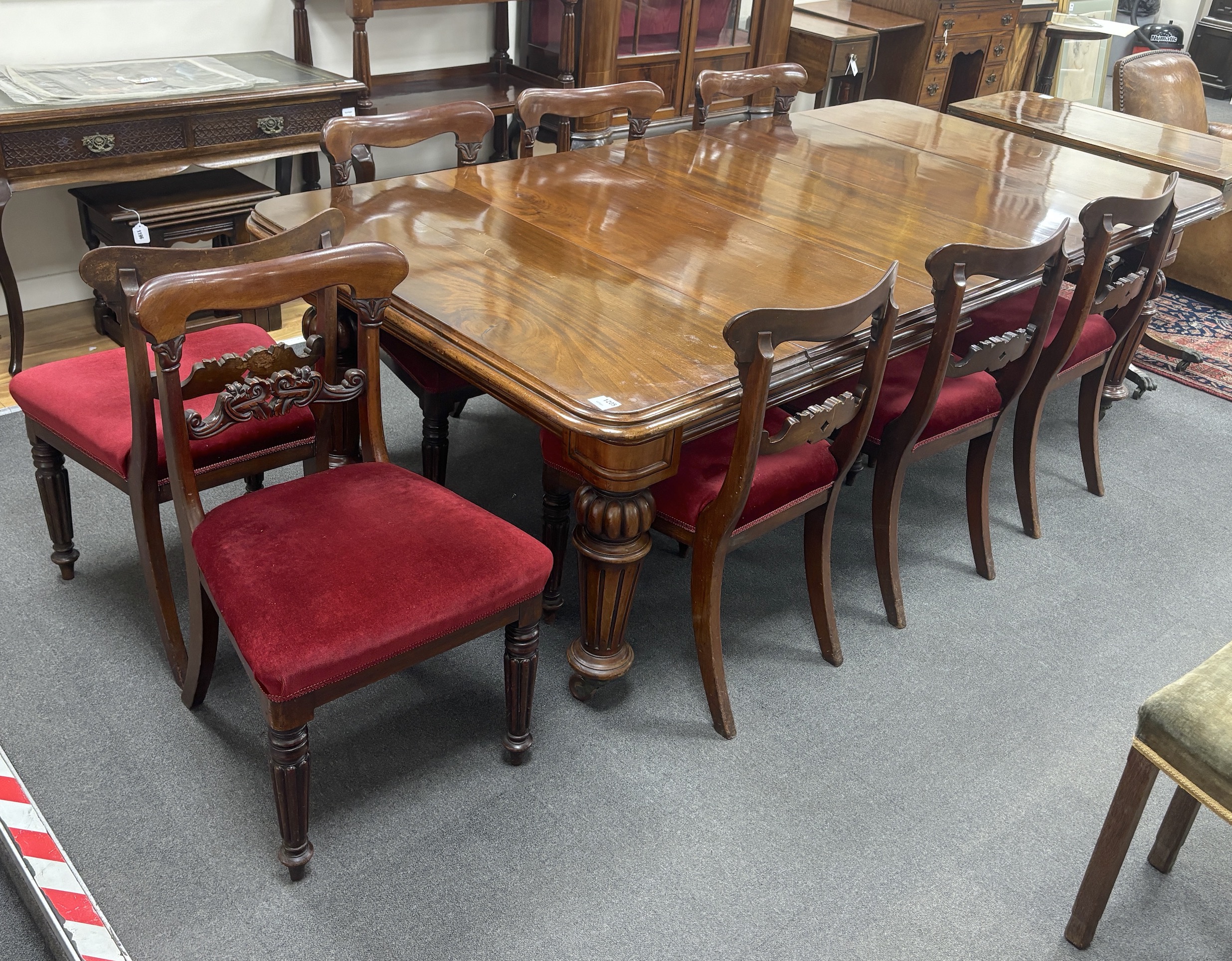 A Victorian mahogany extending dining table, 232cm extended, two spare leaves, depth 118cm, height 72cm together with a set of eight early Victorian mahogany dining chairs